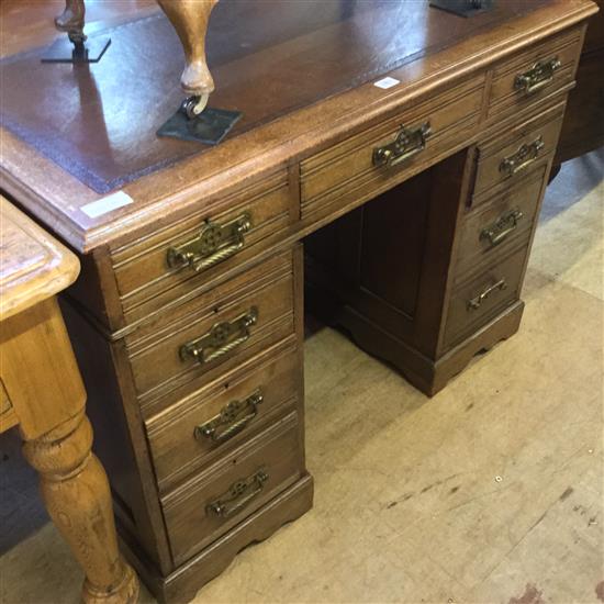 Late Victorian oak nine drawer pedestal desk